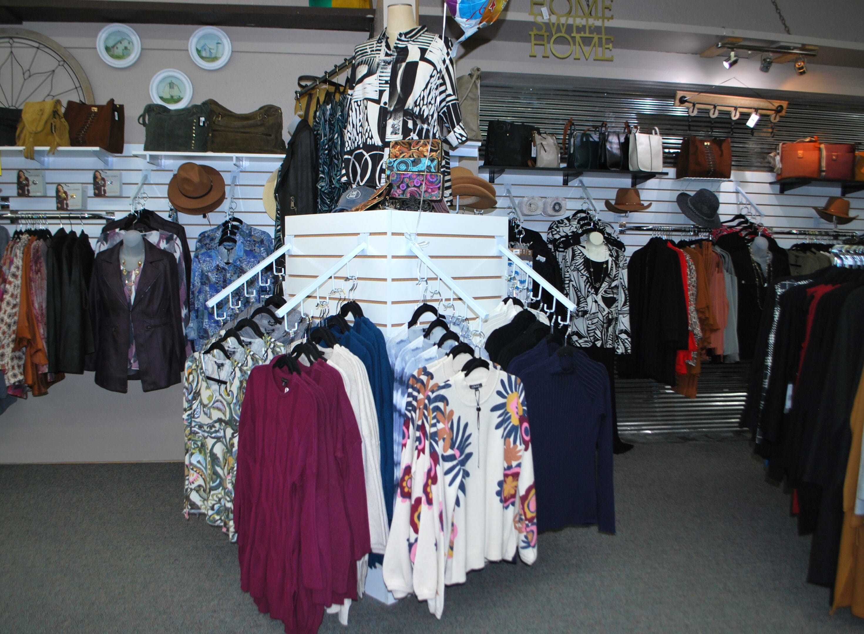 A store with many different types of clothes on display.